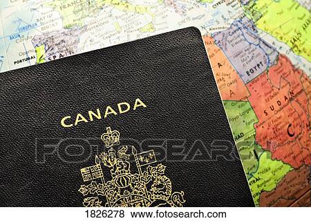 Canadian passport laid over a map of Africa View Large Photo Image Stock Photo - Canadian passport laid over a map of Africa. Fotosearch
