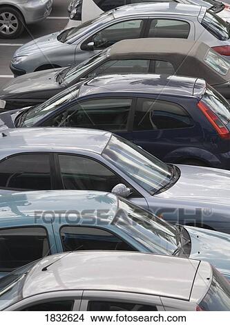 Cars in parking lot View Large Photo Image Picture - Cars in parking lot. Fotosearch