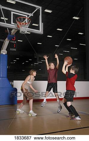 Children playing basketball View Large Photo Image Stock Photo - Children playing basketball. Fotosearch
