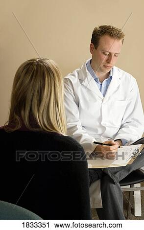 Chiropractor with his patient View Large Photo Image Stock Image - Chiropractor with his patient. Fotosearch