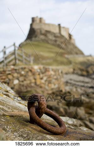 Stock Photograph - Church on a hill, Holy Island, Bewick, England. Fotosearch