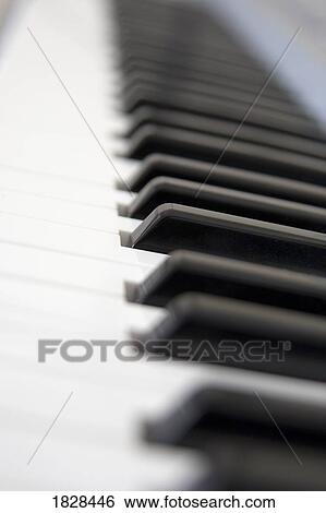Stock Photograph - Close up of piano keyboard. Fotosearch