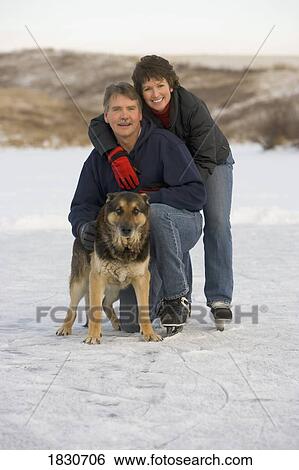 Couple and their dog View Large Photo Image Stock Photograph - Couple and their dog. Fotosearch