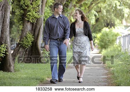 Stock Photo - Couple walking along a path. Fotosearch