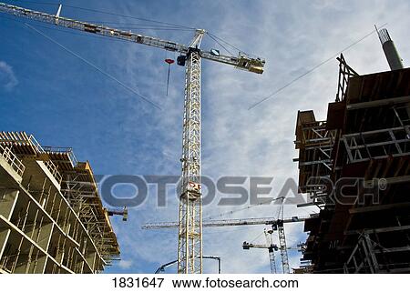 Cranes at work View Large Photo Image Stock Photo - Cranes at work. Fotosearch