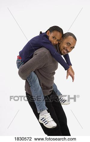 Dad giving daughter piggy back ride View Large Photo Image Stock Image - Dad giving daughter piggy back ride. Fotosearch