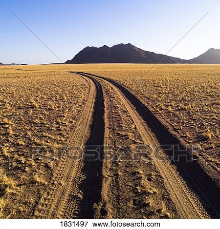Stock Photo - Dirt road through the sand, Namibia, Africa. Fotosearch