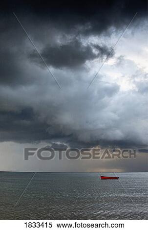 Stock Photography - Empty boat out at sea. Fotosearch
