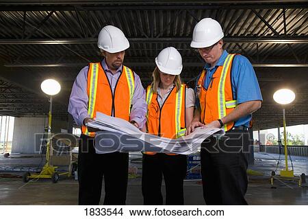 Picture - Engineers on construction site. Fotosearch