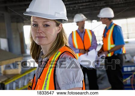 Engineers on construction site View Large Photo Image Stock Photo - Engineers on construction site. Fotosearch