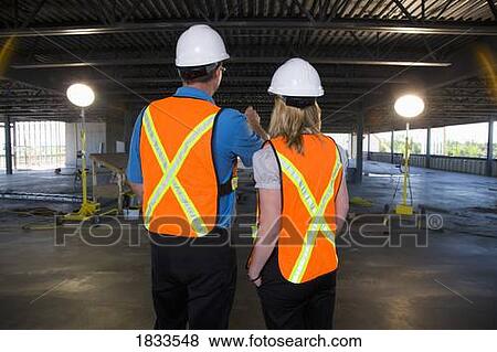 Engineers on construction site View Large Photo Image Stock Photo - Engineers on construction site. Fotosearch