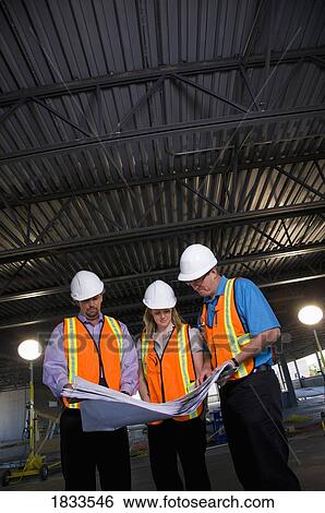 Engineers on construction site View Large Photo Image Stock Photograph - Engineers on construction site. Fotosearch