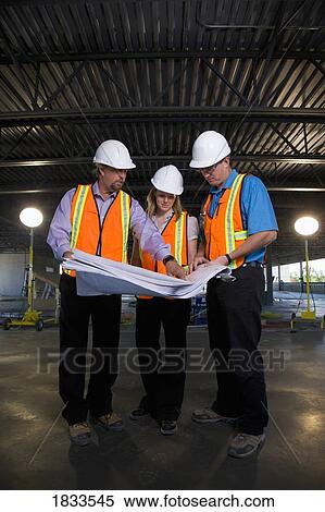 Engineers on construction site View Large Photo Image Stock Photography - Engineers on construction site. Fotosearch