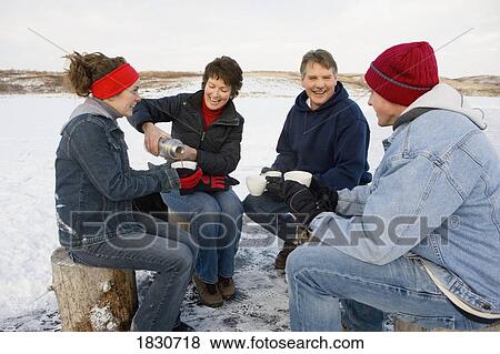 Stock Photo - Family drinking hot cocoa. Fotosearch