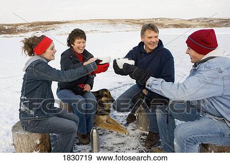 Stock Photo - Family drinking hot cocoa. Fotosearch