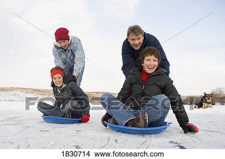 Picture - Family enjoying the winter. Fotosearch