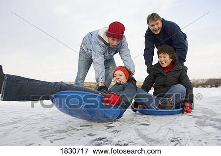 Family enjoying the winter View Large Photo Image Stock Photo - Family enjoying the winter. Fotosearch