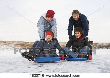 Stock Photograph - Family enjoying the winter. Fotosearch