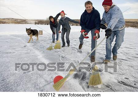 Family playing broomball View Large Photo Image Stock Image - Family playing broomball. Fotosearch