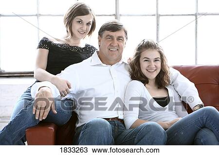 Family portrait of father with two daughters View Large Photo Image Stock Image - Family portrait of father with two daughters. Fotosearch
