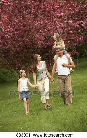 Stock Image - Family walking together. Fotosearch