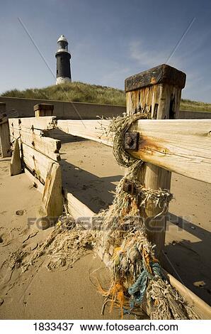 Stock Photo - Fence and lighthouse. Fotosearch