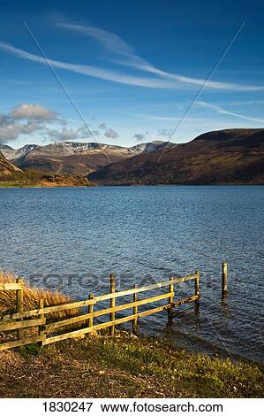 Stock Photo - Fence on lake shore at Lake District, Cumbria, England. Fotosearch