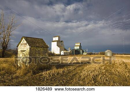 Stock Photo - Field with grain elevators. Fotosearch