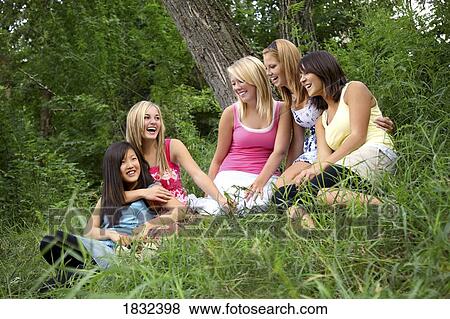 Five girls sitting in the grass View Large Photo Image Stock Photo - Five girls sitting in the grass. Fotosearch