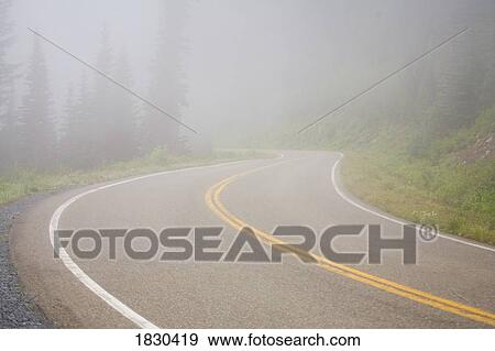 Stock Photo - Foggy road, Mount Rainier National Park, Washington, USA. Fotosearch