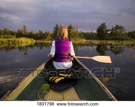 Stock Photo - Girl canoeing. Fotosearch