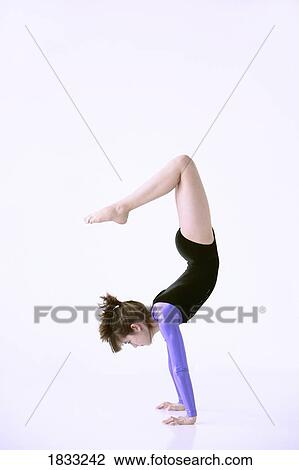 Girl doing handstand View Large Photo Image Stock Image - Girl doing handstand. Fotosearch