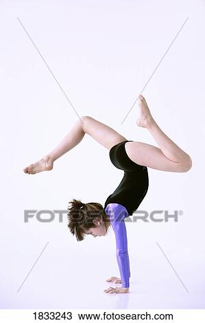 Girl doing handstand View Large Photo Image Stock Image - Girl doing handstand. Fotosearch