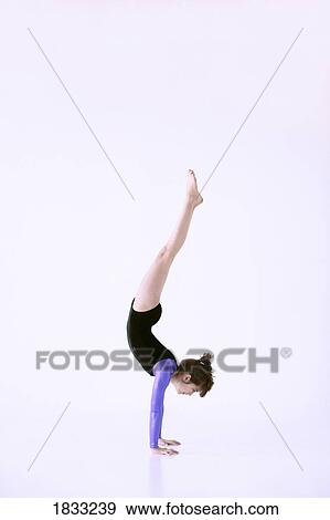 Stock Photo - Girl doing handstand. Fotosearch