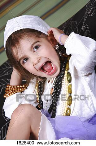 Girl dressing up View Large Photo Image Stock Image - Girl dressing up. Fotosearch