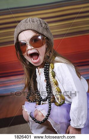 Girl dressing up View Large Photo Image Stock Image - Girl dressing up. Fotosearch