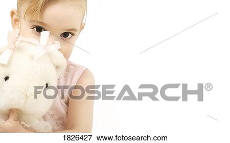 Stock Photo - Girl holding a stuffed animal. Fotosearch