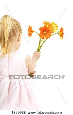 Girl holding gerberas View Large Photo Image Stock Photo - Girl holding gerberas. Fotosearch