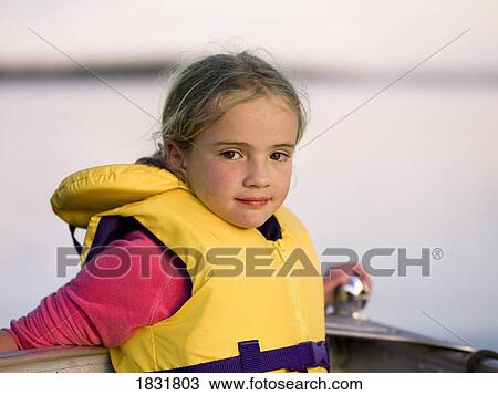 Stock Image - Girl in a personal floatation device. Fotosearch