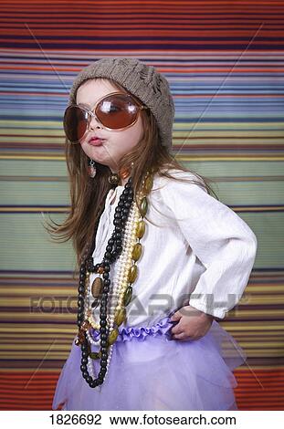 Stock Image - Girl in dress up clothes. Fotosearch