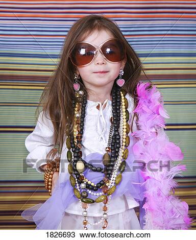 Stock Image - Girl in dress up clothes. Fotosearch