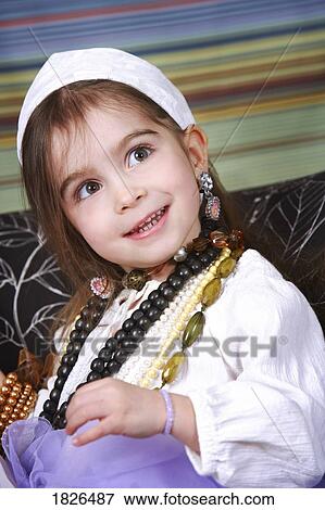 Girl in dress up clothes View Large Photo Image Stock Photo - Girl in dress up clothes. Fotosearch