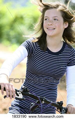 Girl on bike View Large Photo Image Stock Image - Girl on bike. Fotosearch