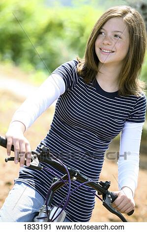 Girl on bike View Large Photo Image Stock Image - Girl on bike. Fotosearch