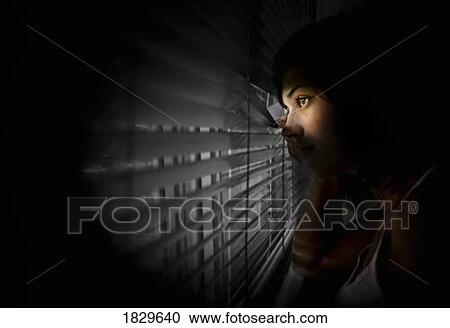 Girl peeking out of window View Large Photo Image Stock Image - Girl peeking out of window . Fotosearch