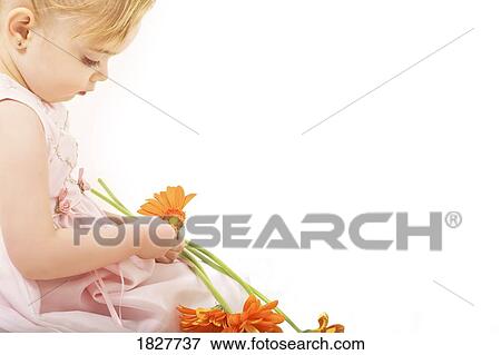 Girl playing with flowers View Large Photo Image Stock Photo - Girl playing with flowers. Fotosearch