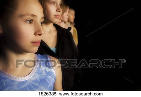 Stock Photography - Girls standing in a line. Fotosearch