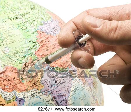 Stock Photo - Giving injections to the world. Fotosearch