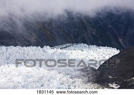 Stock Photography - Glacier in the mountains of New Zealand. Fotosearch