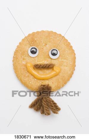 Stock Image - Happy face cracker. Fotosearch